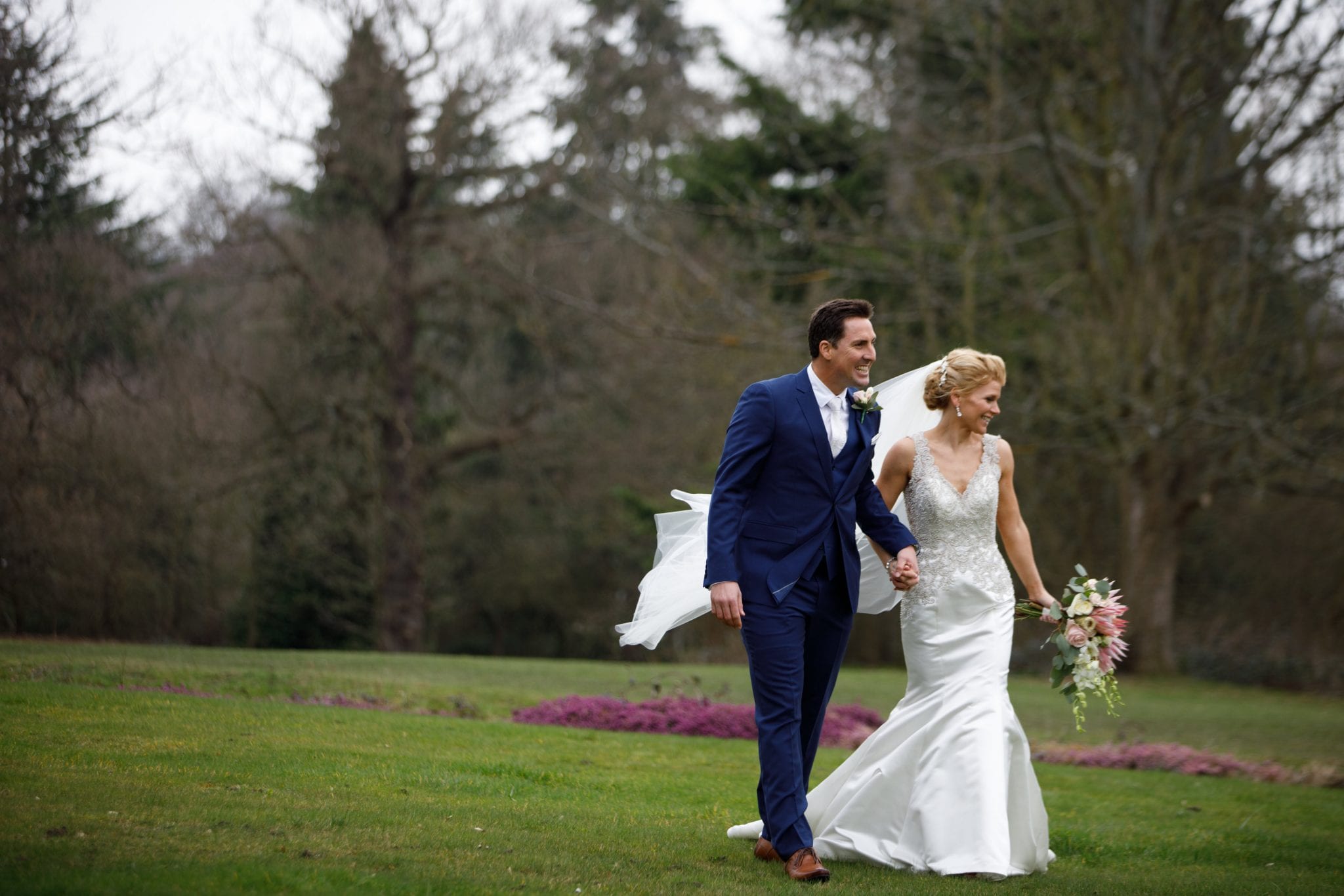 newlyweds couple bride groom veil shot
