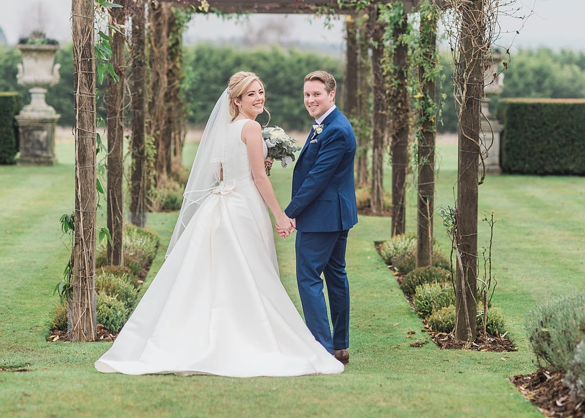 newlyweds outside Cain Manor gardens in December