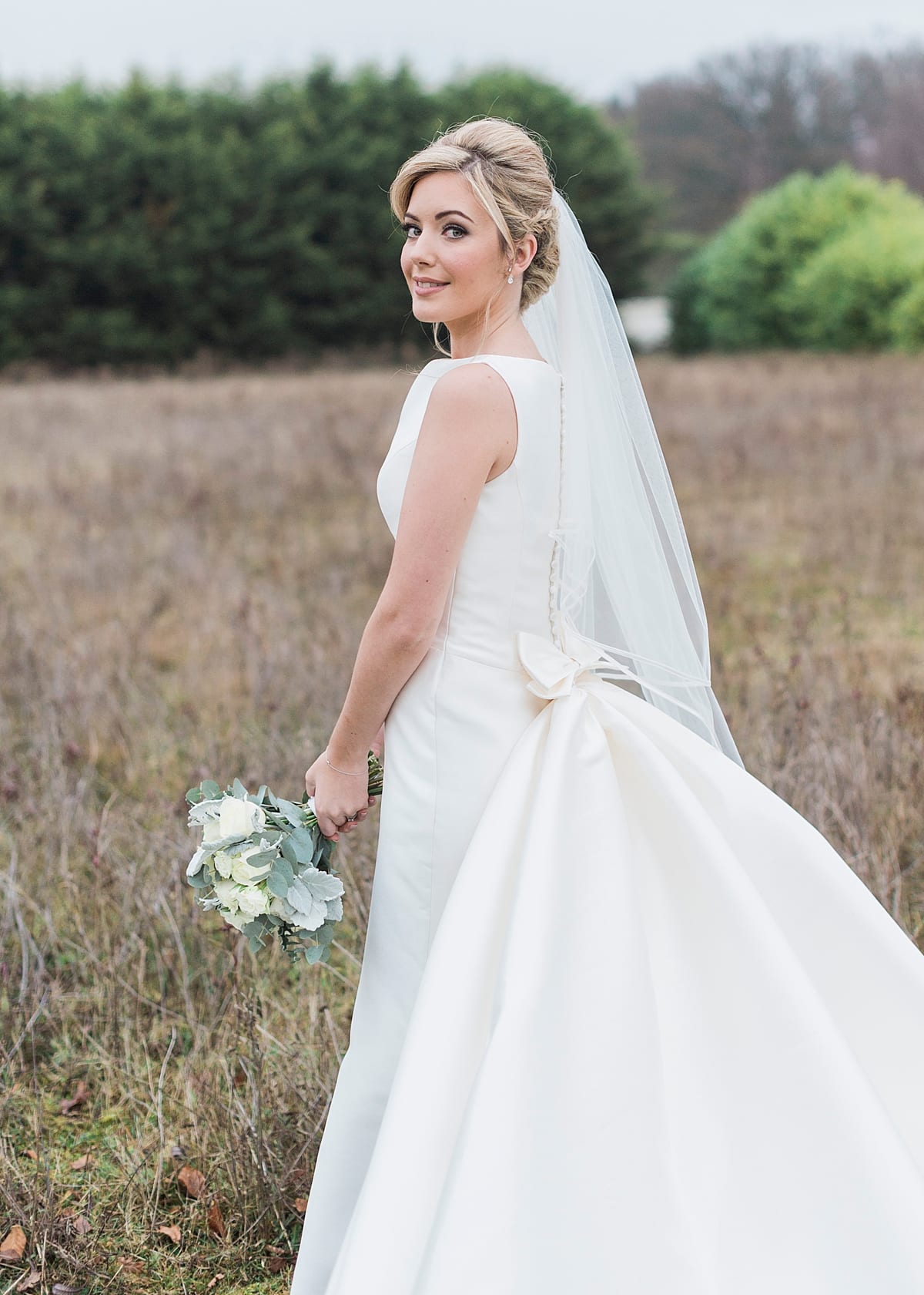 satin silk bridal gown with back bow detailing
