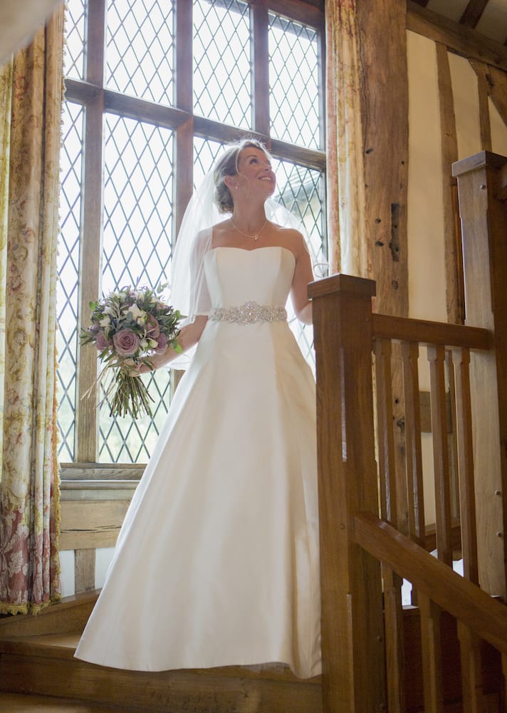 Bride ready to walk the aisle bridal staircase bridal preparation photos
