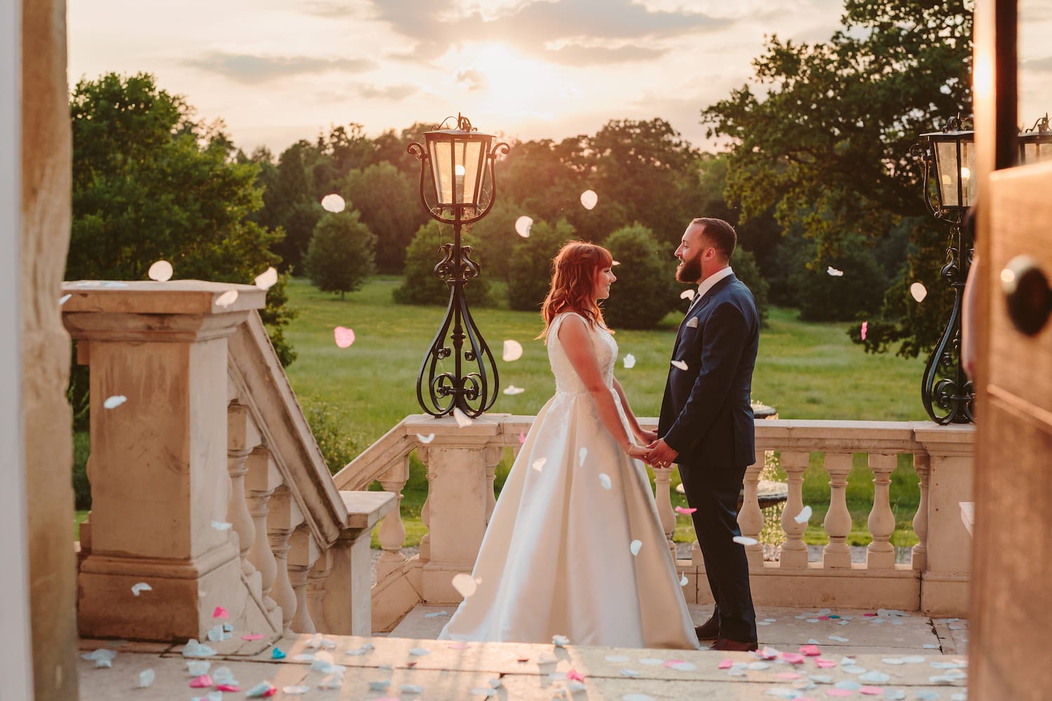 Bride and Groom petal confetti shot outside Botleys Mansion
