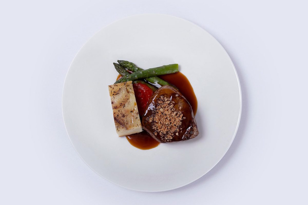 Beef main course with asparagus and rich jus from the Harper Kitchens wedding menu at Botleys Mansion, Surrey