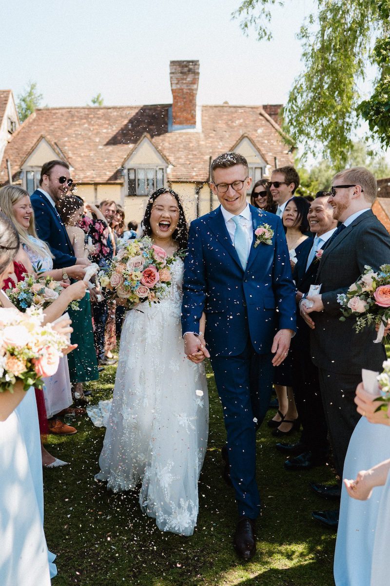 newlywed couple confetti aisle Cain Manor Hampshire