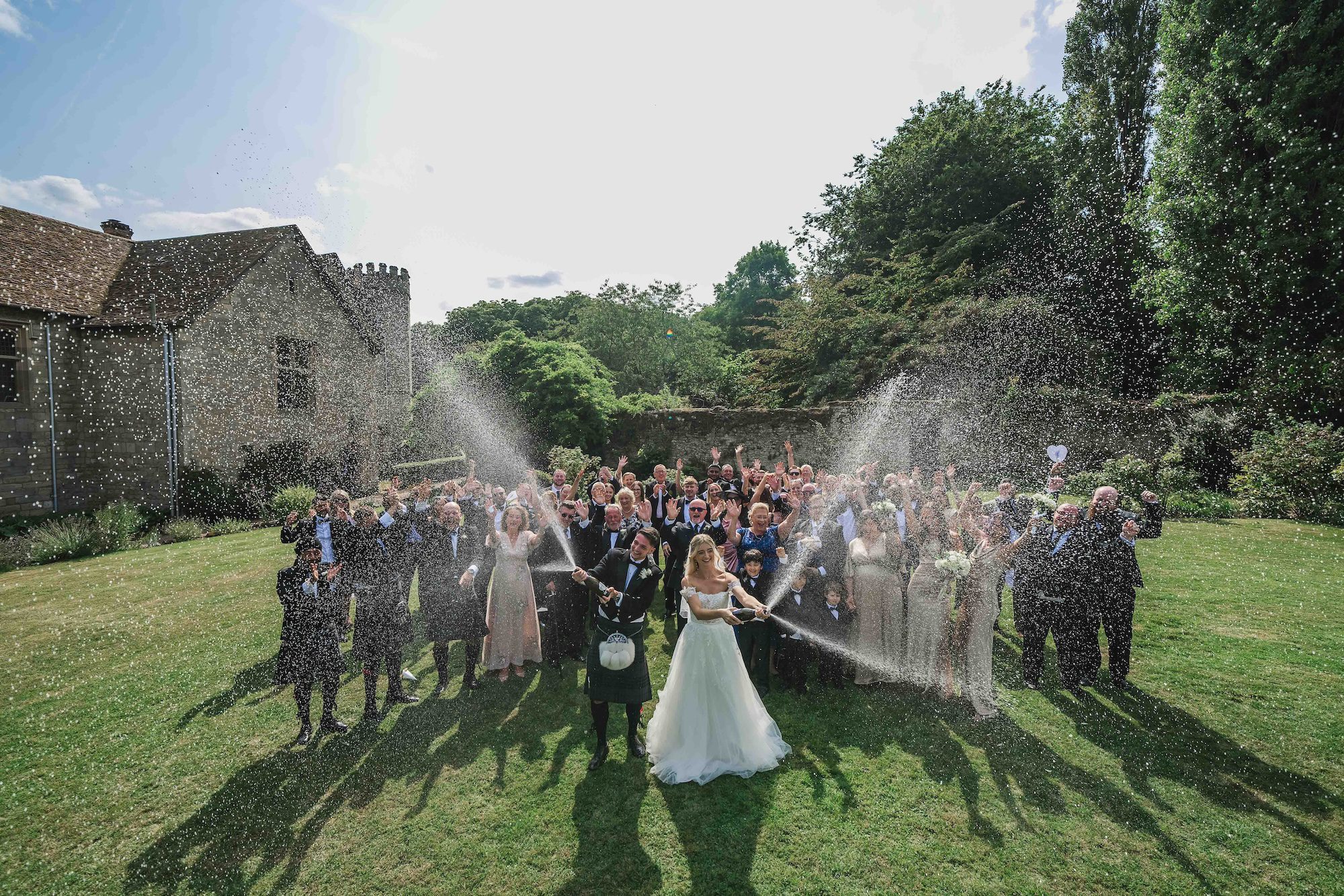 Outdoor drinks reception prosecco spray Notley Abbey Buckinghamshire
